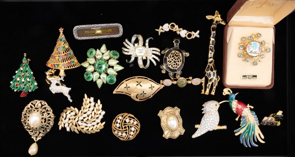 Vintage Brooches (18): 18 brooches including a signed 14K gold filled "mother" pin in box, scarab pin with real jade nephrite and rose quartz, a Christmas tree marked JJ and more.