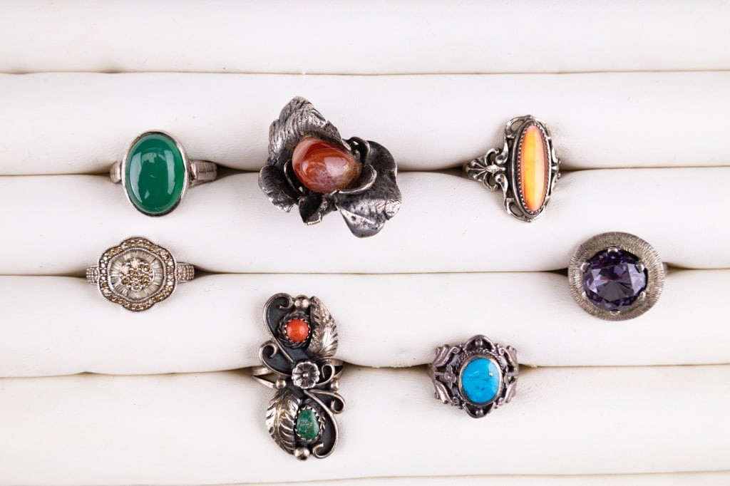 Ruby Sapphire, Turquoise, Coral & More Rings: Sterling silver rings including a ruby sapphire (size 7), nephrite jade (size 6), turquoise and coral (size 5.25 and 7), agate (flower ring, size 6), orange glas oval (size 7) and a size 7 ring with 5