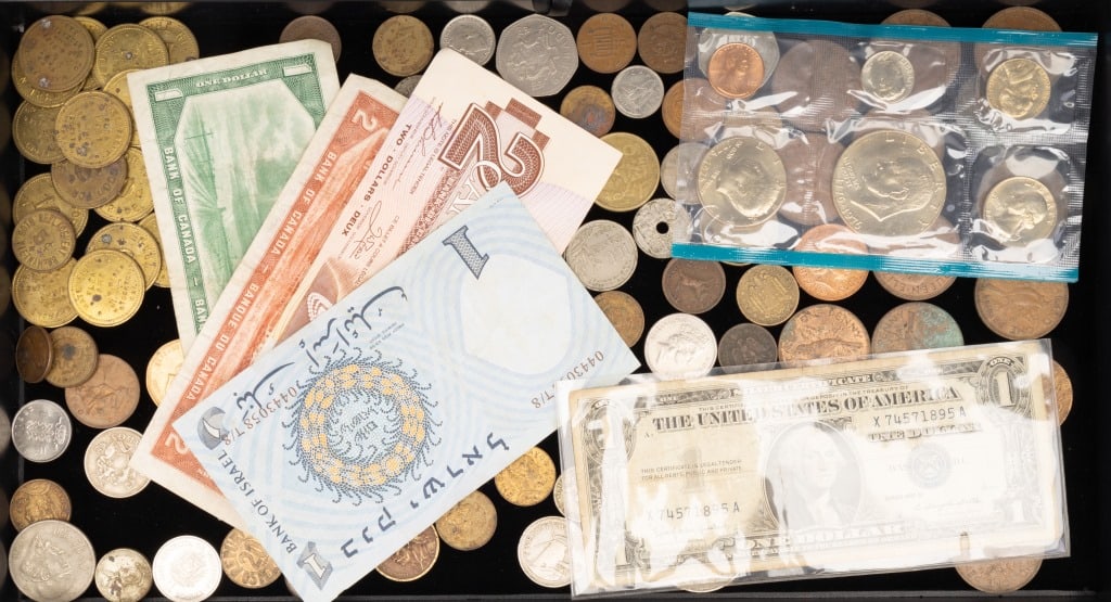 International & USA Currency, Coins, Tokens: Coins and currency lot includes 75+ international, 4 Canadian bills, 1976 USA Proof set, a silver certificate, and 19 tokens.