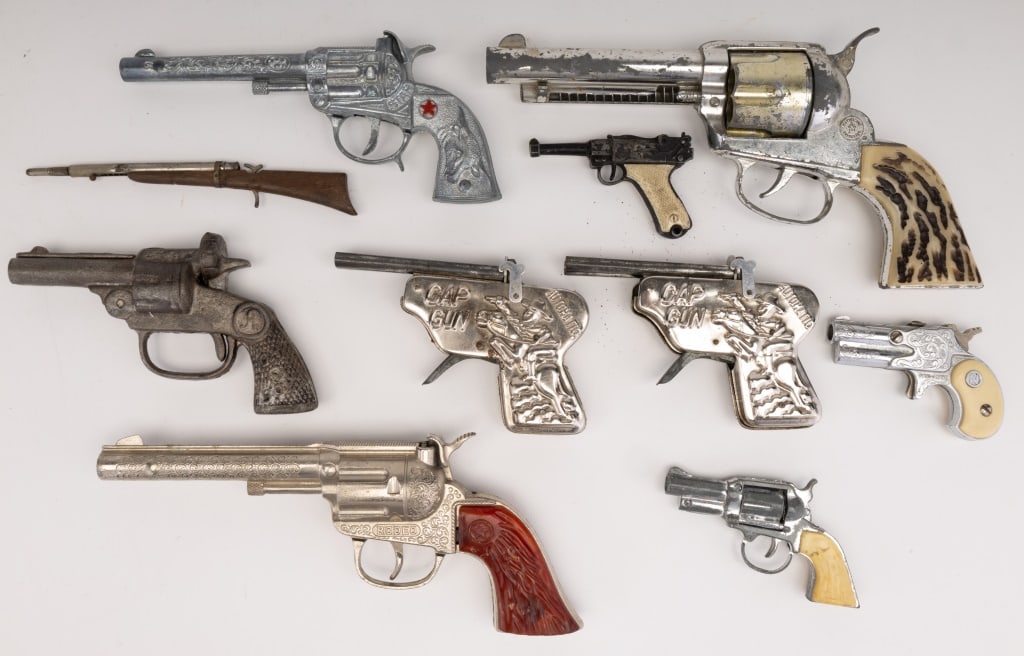 Vintage Cap Guns (10): 10 vintage cap guns including Hubley (rodeo), "A", Star, Matell, "Cap Gun" and Dyna-mite.