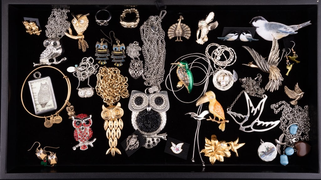 Owls & Birds Jewelry: 31 items of avian jewelry featuring a vintage 2" J.J. (Jonette Jewelry) googly eye toucan pin, an Avon googly eyed owl on a branch pin, an Avon reticulated owl pendant on a chain necklace, a Monet hum