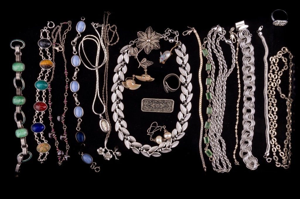 Sterling, Name Brand, & More Jewelry: Sterling and name brand jewelry including a 7 3/4" JB sterling multi circle links bracelet, an 18" sterling chain with cherry blossom branch pendant, an 18" sterling and amethyst necklace, a 7 1/4" st