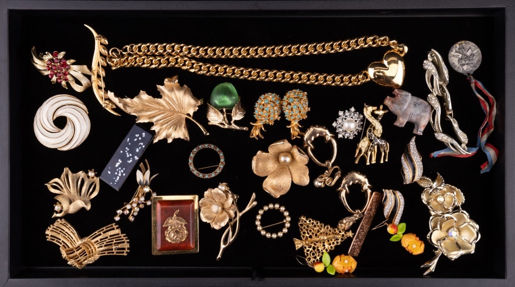 Estate Costume Jewelry: Signed Trifari white enamel / circle brooch, star bracelet, Monet, vintage copper, large Trifari leaf brooch and much more.