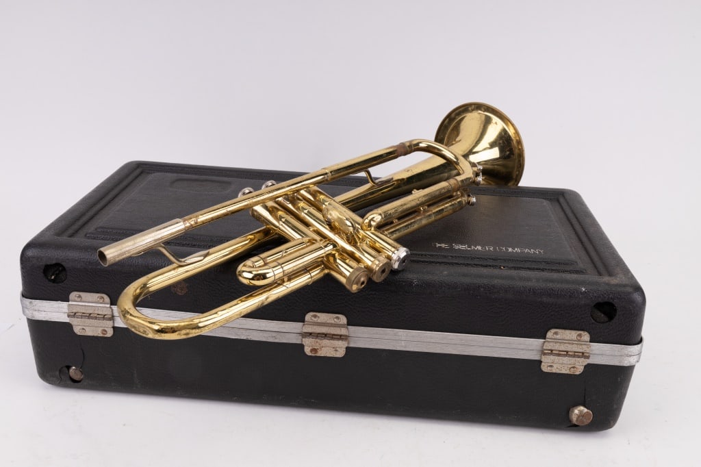 Vincent Bach Trumpet: Vincent Bach Bundy trademarked trumpet from Selmer Co. with mouthpiece (Box C). Valves intact but one is stuck. It would need maintenance.
