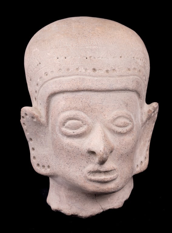 Egyptian / Asian Clay Bust: Egyptian or Asian clay bust measures approx 5" H with rough edged base. Has a chip off of both ears and two small hairline cracks at base. May have been purchased in India as consignor lived there for