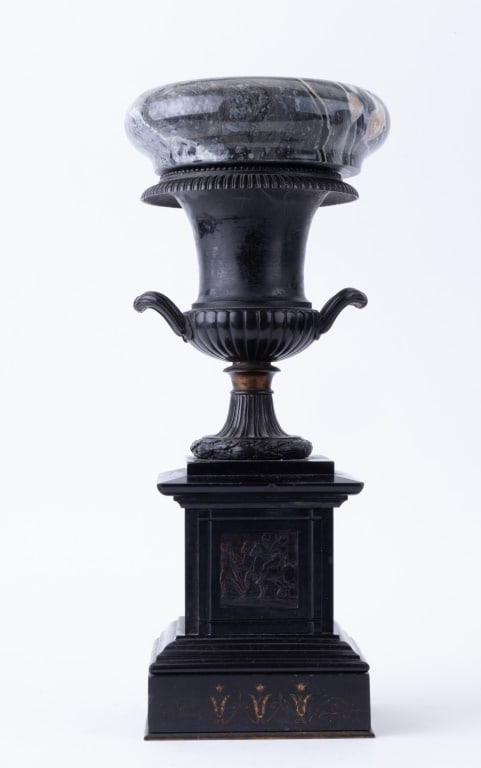 Bronze and Marble Urn, late 19th / early 20th C: Bronze and black marble urn / trophy cup on a marble base with green marble insert / bowl which may not be original to the piece. Urn is believed to be French. Approx 14.5" H