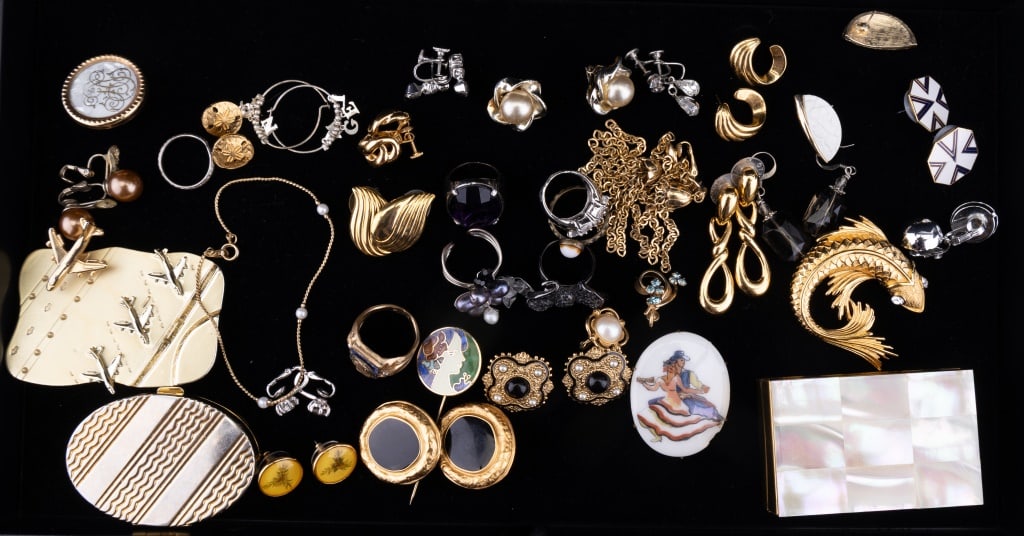Costume Jewelry, Some Name Brand: A Monet fish pin, American Beauty makeup box with MOP type top (mirror needs reglued), a pill box, an airport brooch, Roman + Monet + Napier earring sets, two single earrings (one GF), and other costu