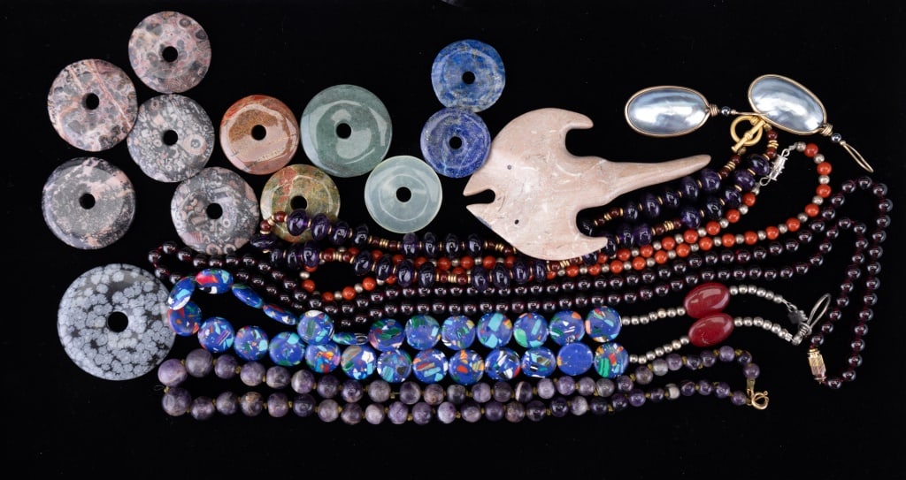 Amethyst and Garnet Necklaces & Stone Formations: Amethyst, coral and garnet necklace with other stone necklaces as well as jade, lapis and large hand carved skate and other loose stone forms.