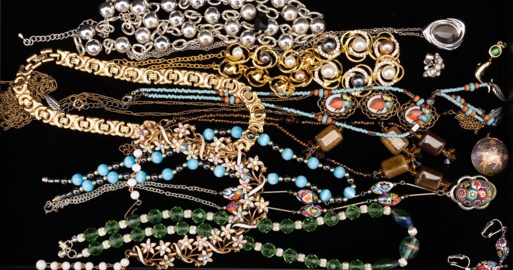 Silver Tone, Gold Tone, Beaded & More Necklaces: Silver tone, gold tone and beaded necklaces. There is a millefiori style necklace with matching earrings. There is also a Cloisonne deer pendant.