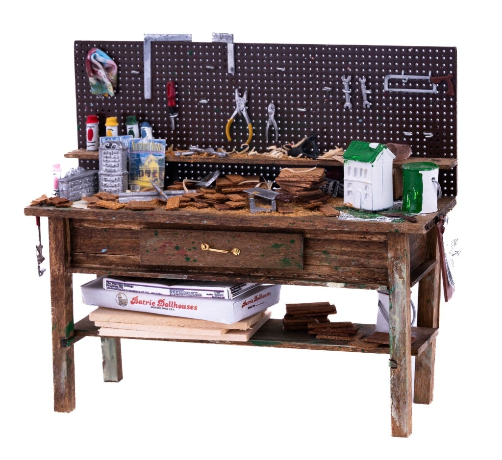 Hobbiest Work Bench & Accessories Miniatures: Dollhouse hobbiest work bench with pegboard backing, tools and projects (approximately 5" high x 6" wide x 2" deep). Accessories include Batrie Dollhouses kit, paints, scrap wood, woodworking tools, m