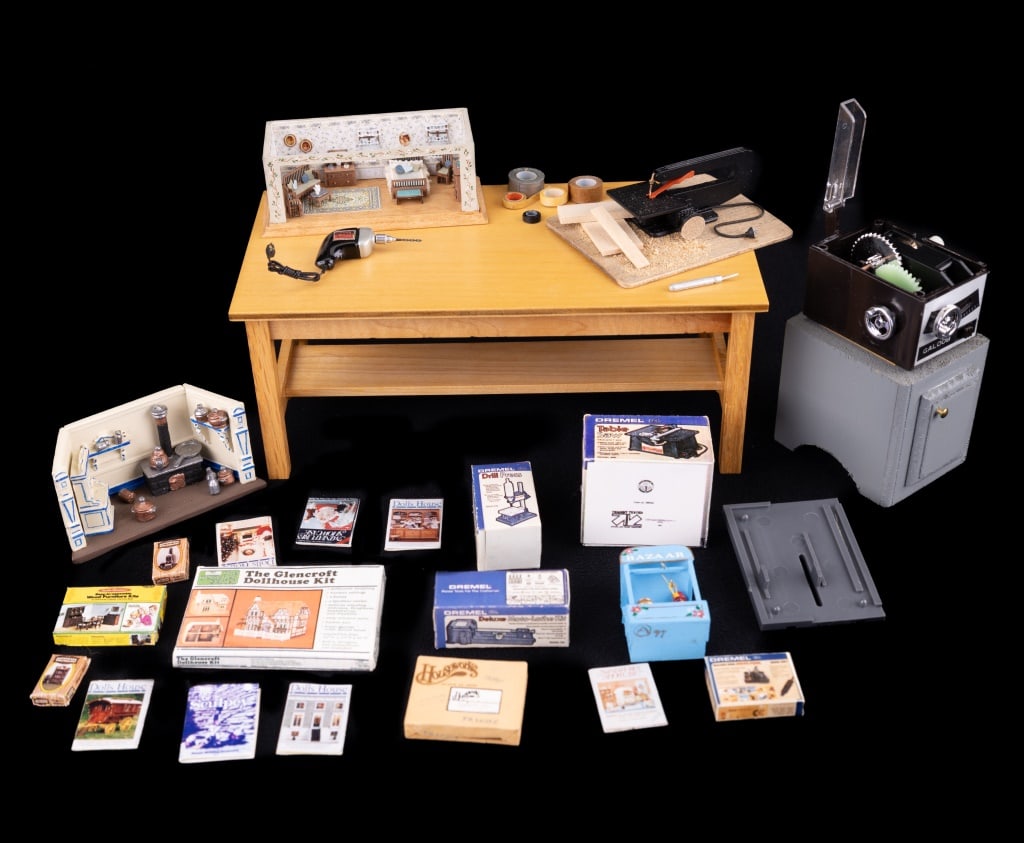 Shadowbox Dollhouses & Accessories: Dollhouse studio miniatures including two 1:144 scale shadowbox dollhouses, one kitchen, one bedroom (signed Hemy 03), market stand, band saw with wood and sawdust, table saw, four boxes of Dremel too