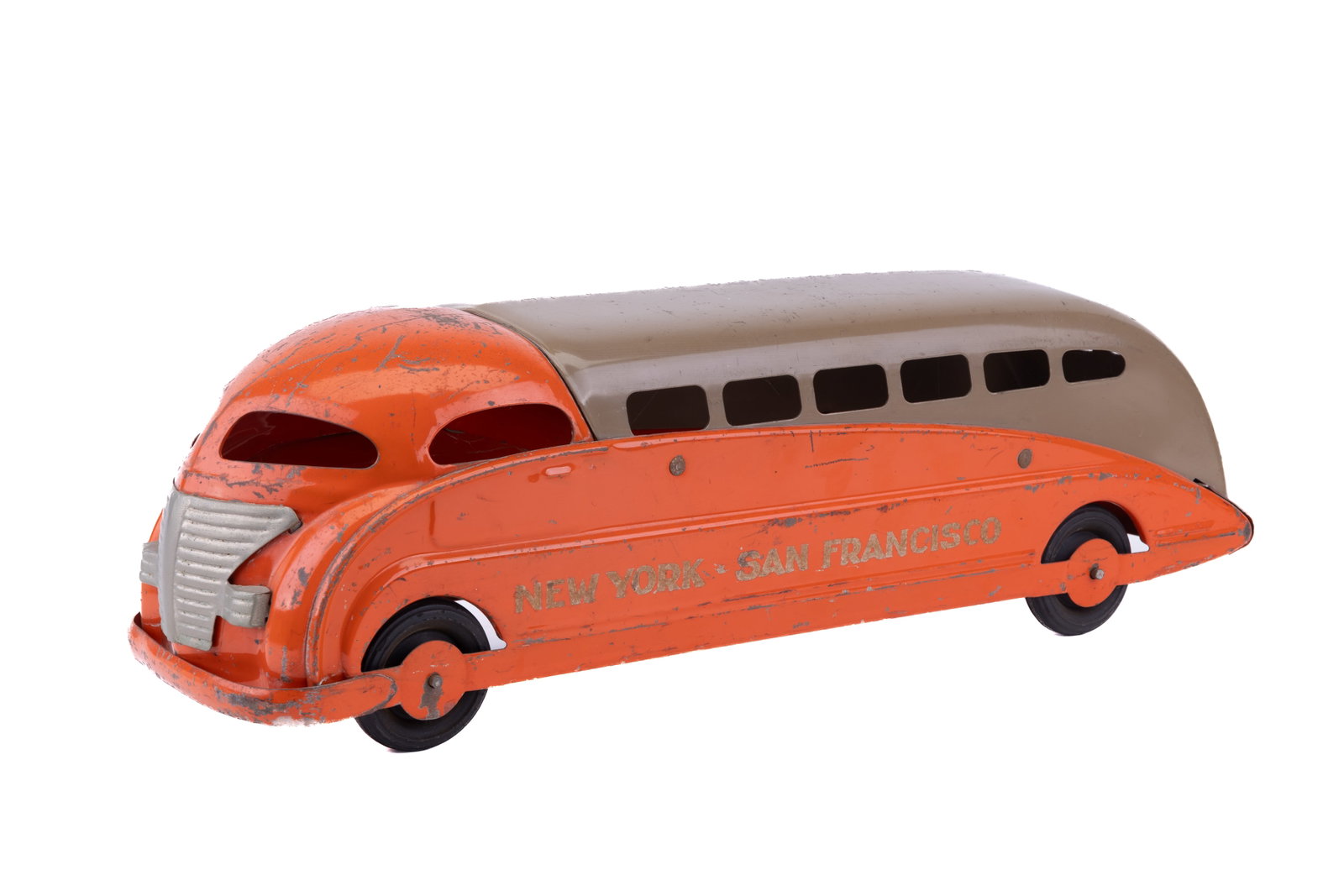 Steelcraft New York - San Francisco Streamline Bus: Antique Steelcraft New York - San Francisco streamline bus in duotone orange and tan. Measures approx 20.5" L x 6.5" W x 7" H. Has paint loss consistent with use and age.