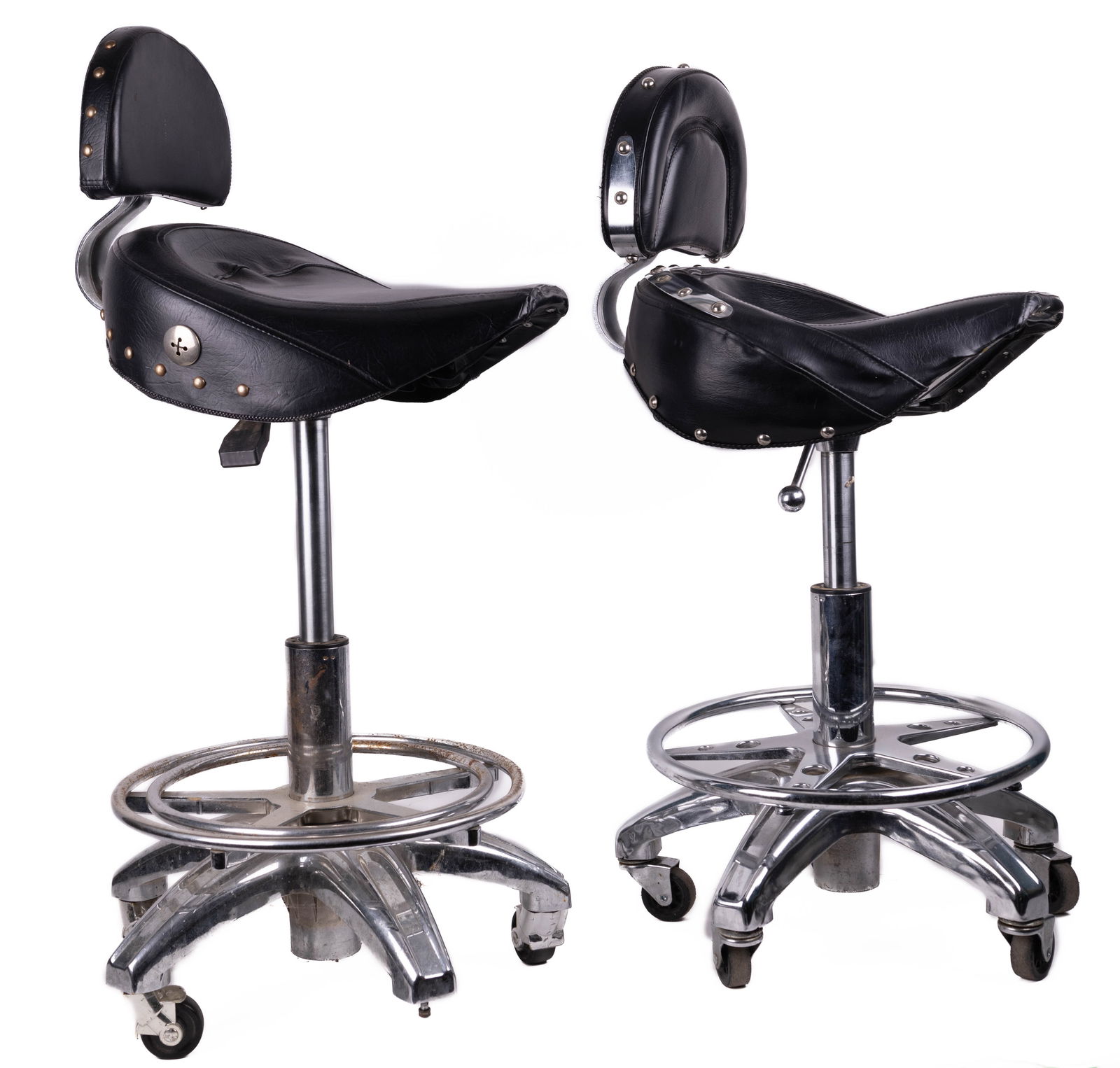 Chrome Biker Stools (2): Two chrome leather style biker stools each on a round base with 5 casters, with ability to raise and lower. One is missing a few grommets at the seat back and a caster wheel.