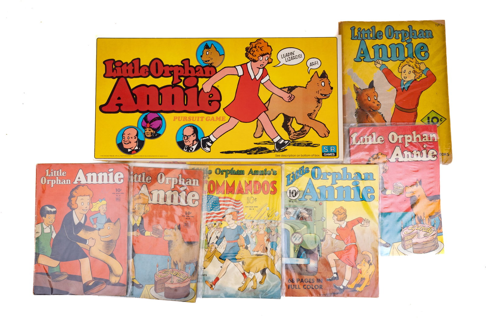 1930s-40s Little Orphan Annie Comics & Game: 1930s-40s 10 cent Little Orphan Annie comic books Nos. 7, 12, 18, 52, 76, and unknown. Also includes Little Orphan Annie Pursuit Game by S&R Games. Box and toy in excellent condition.