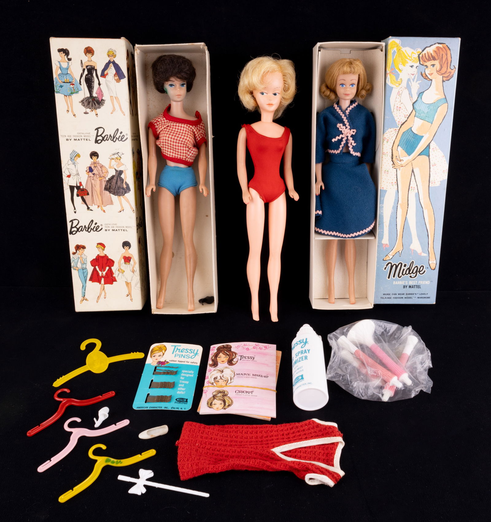 Vintage MCM Barbie Dolls: Two Barbie dolls and another Barbie style doll. Midge Barbie dated 1958 with another date. The second Barbie is dated but illegible. Both Barbies include original boxes. Also includes a third doll tha