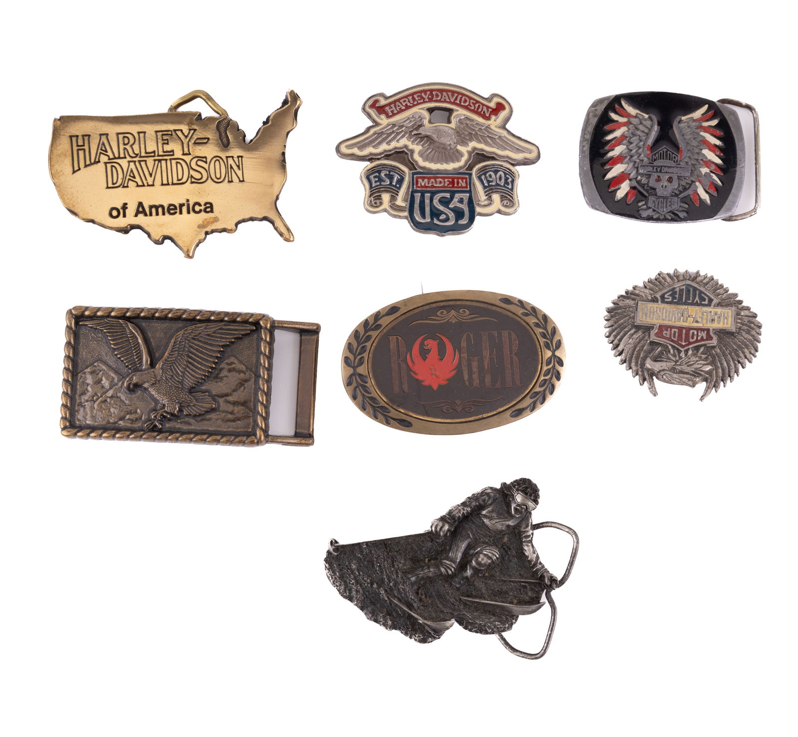 Harley Davidson & More Belt Buckles: Seven belt buckles including four Harley Davidson motorcycle as well as a skier, "Roger" and eagle.