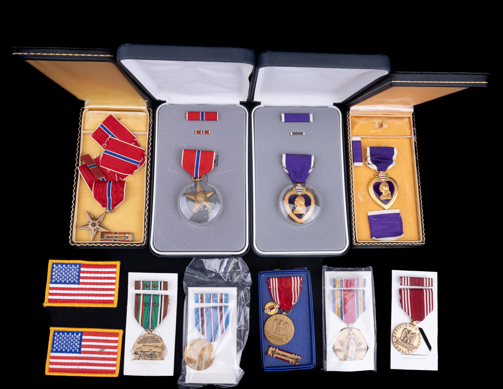Purple Hearts, Bronze Stars & Other Medals: 9 United States decorative medals with original boxes, including 2 Purple Hearts, 2 Bronze Stars, American Campaign, World War II, and another medal that is marked Efficiency Honor Fidelity. Also incl
