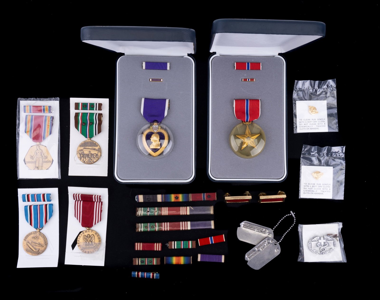 Purple Heart, Bronze Star, & Other Medals: 6 United States dedication medals, including American Campaign, World War II, Purple Heart, Bronze Star, and others. All in original boxes. Also includes decorative military bars, dog tags, and pins.