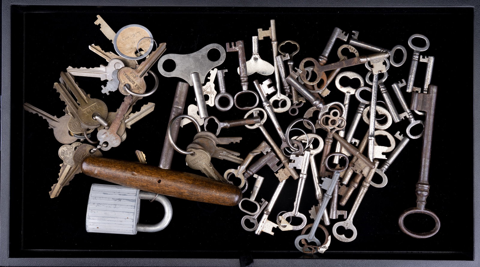 Large Lot with Skeleton, Clock & Other Keys: Various keys including 37 skeleton keys, 20 regular keys, 3 clock keys, including one large one with a wood handle around 5" long, and a lock.