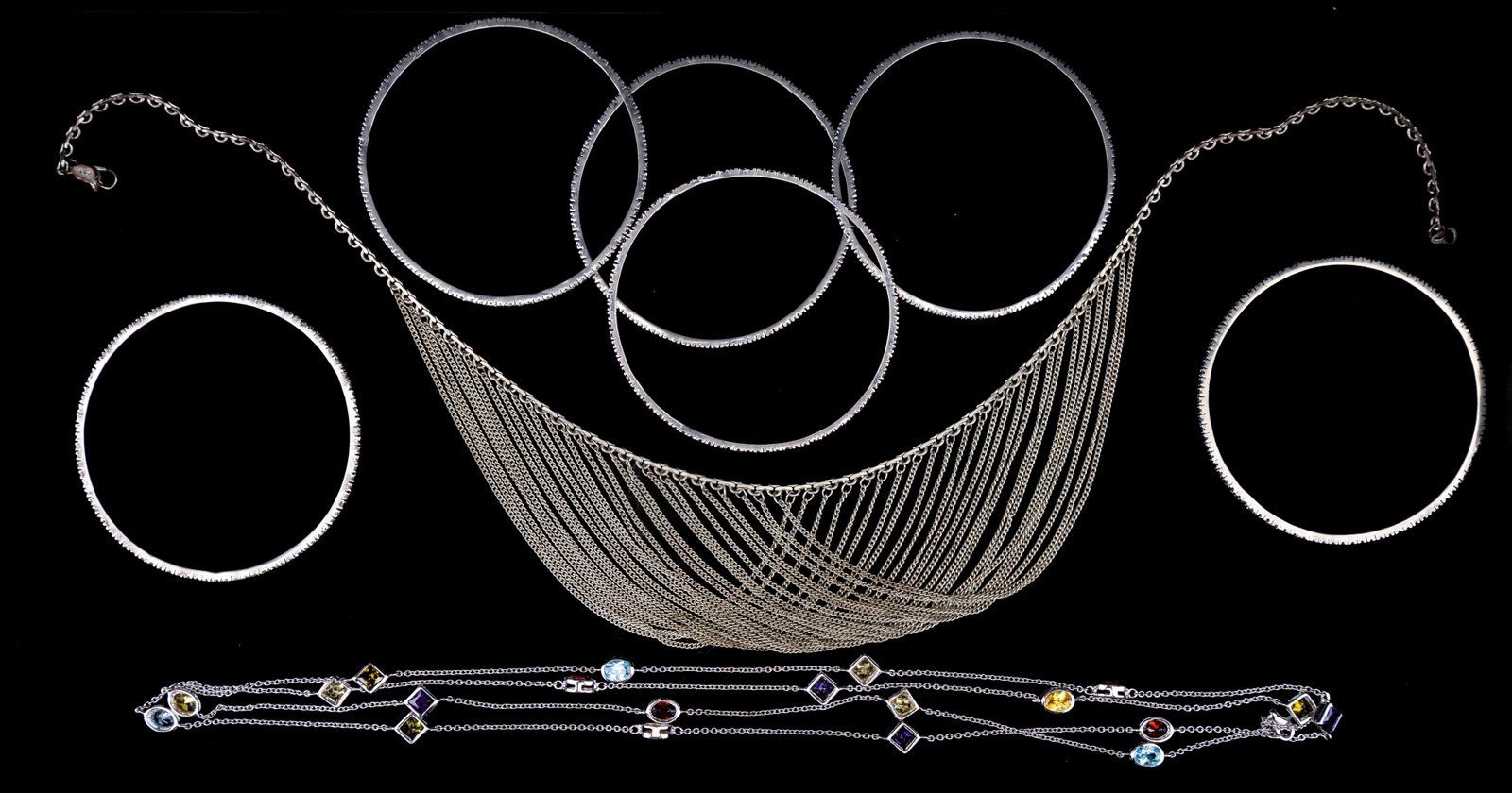 Sterling Silver & Cubic Zirconia Jewelry: 48" sterling silver and cubic zirconia necklace, 18" sterling silver necklace with multi-strand bib, and six sterling silver bangles with glass, topaz, and tourmaline stones. All approximately 2 3/4" 