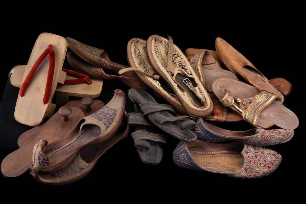 International Native Shoes/Sandals (11 Pairs): 11 pairs of sandals including 5 from India, 1 Turkish, 1 Japanese, 1 Greece, 1 Lebanon, 1 Kashmir and 1 Middle East. One pair from India were made using bicycle tires. All in used condition. Shoes / f