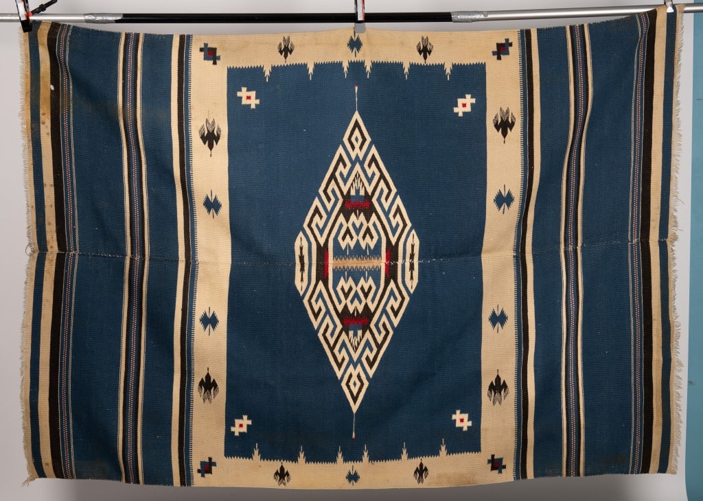 Native American Antique Blanket Rug w/ Birds: Native American antique blanket / rug with blue field, tan and black lines with central medallion and border of birds. Measures approx 51" x 73". One moth hole approx 1/2", has stains and loss.