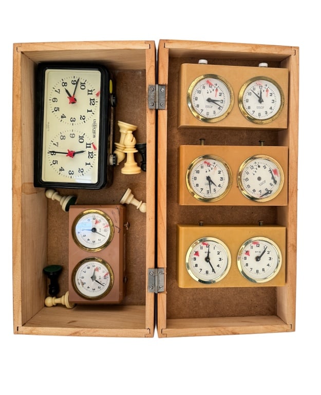 U.S. Chess Foundation Chess Game Timers (5): Five chess game timers including four U.S. Chess Foundation and one BHB. There are also some chess pieces. All items are in a wooden storage box. Have not been tested.
