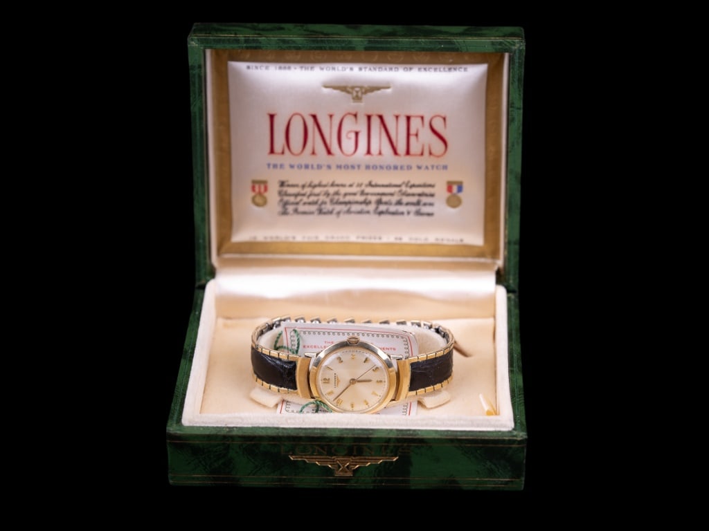 Longines Antique Watch: Longines circa 1950s "World's Most Honored Watch" 10K gold fill wind-up watch with original box. Working order and very good condition.