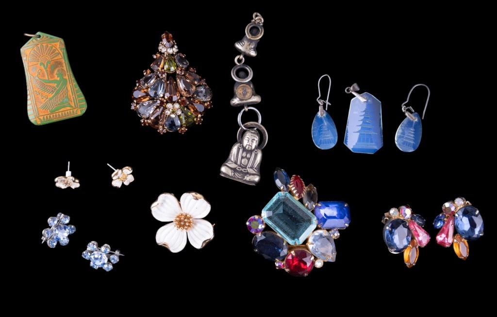 Trifari and Estate Vintage Jewelry: Trifari dogwood brooch, chinese watch fob with small compass on verso, hieroglyphic design pendant, Austrian gold to topaz hue brooch, early earrings and more.
