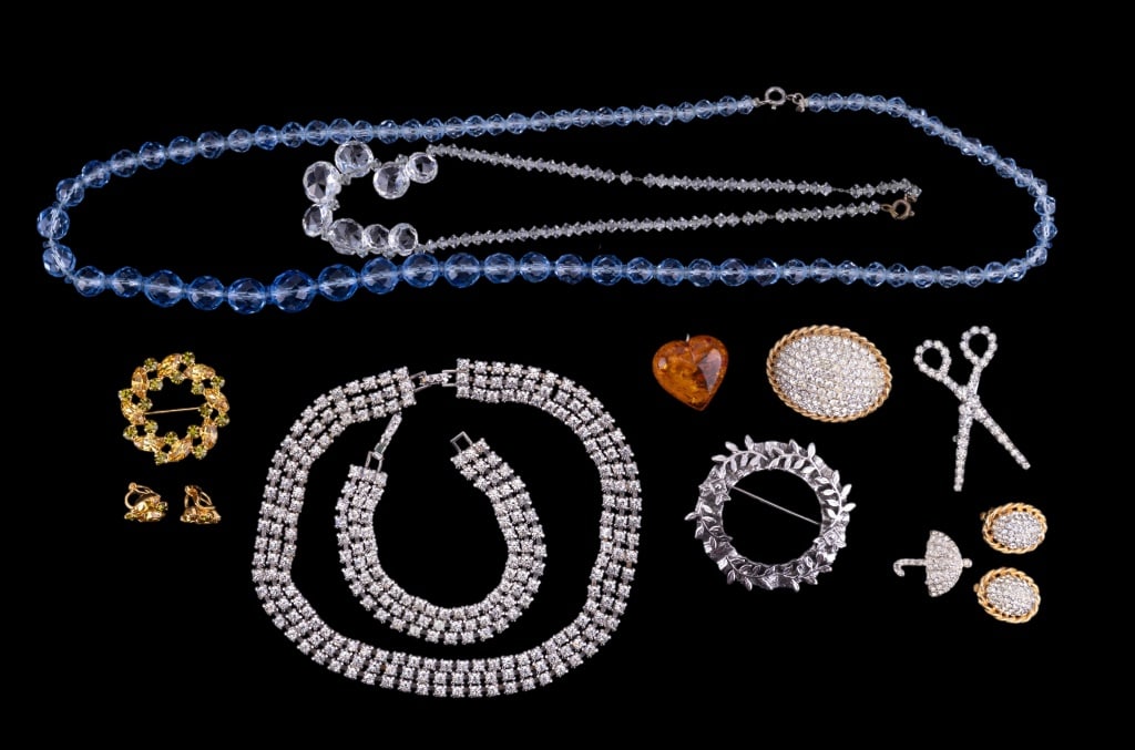 Kramer & Vintage Estate Jewelry: Kramer signed crystal brooch with matching earrings, amber-hue heart pendant (no bale), and rhinestone crystal brooches and necklaces.