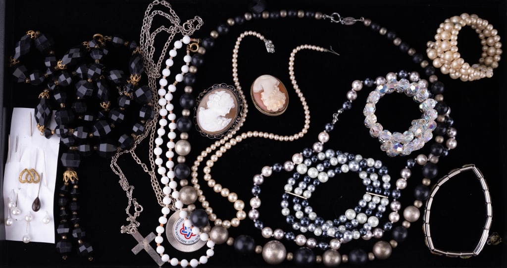 Vintage Cameos, Stick Pins & More: 1 marked sterling silver cameo, 1 other cameo, 8 stick brooches, 4 faux pearl necklaces, 3 other necklaces and 3 bracelets.