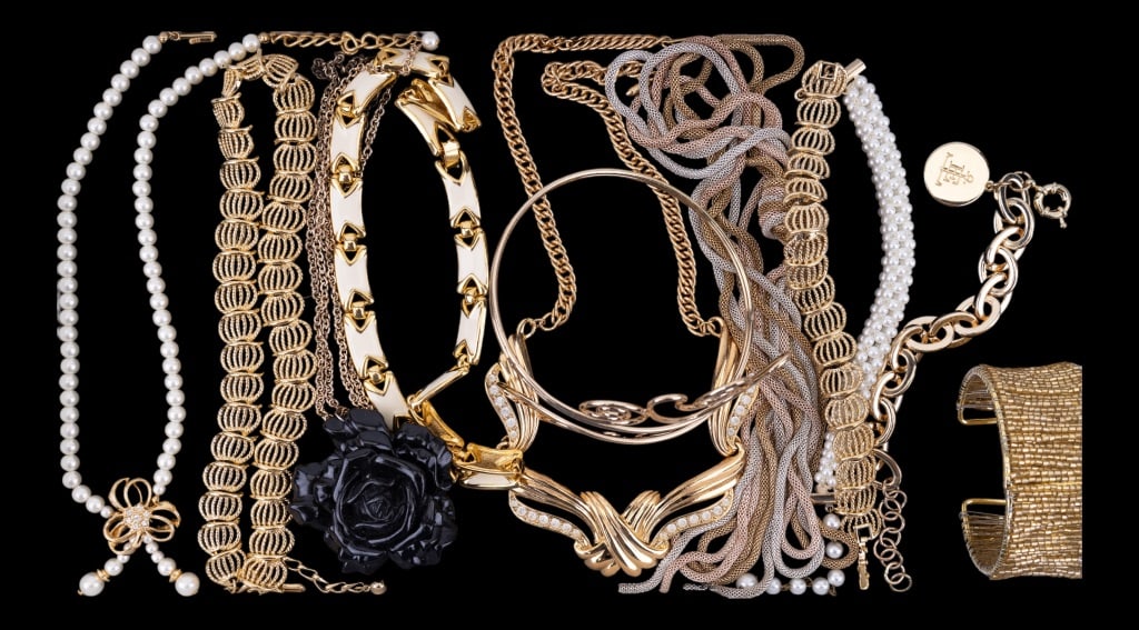 Gold Tone Costume Jewelry: Gold tone jewelry lot including 6 necklaces, 4 bracelets and an arm cuff.