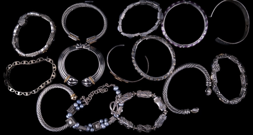 Silver Tone Bracelet Lot: Lot of silver tone bracelets including bangle, cuff and dangle.