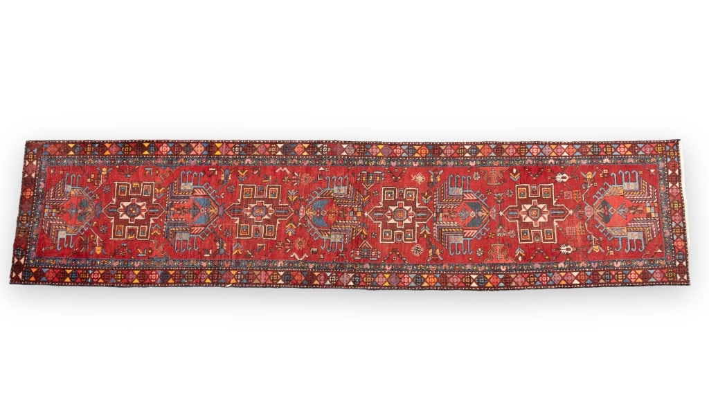 Persian Heriz Runner: Persian Heriz Runner measuring approx 2'10" x 12'4". Some loss to pile.