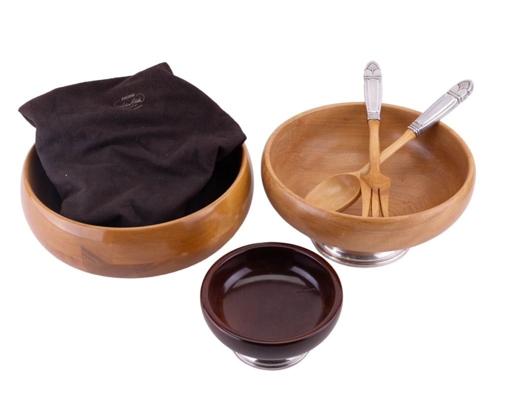 MCM Sterling Silver Footed Wood Salad Bowls (3): Nesting bowls, largest 4.75" H x 11" dia. Foot marked sterling. Also includes sterling handled similar wood spoon and fork. Mid century modern. Consignor notes date them to approx 1948.