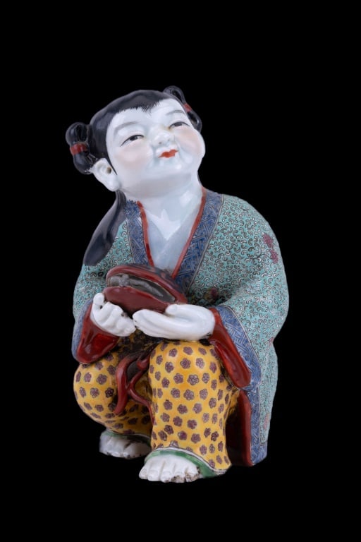 Chinese Porcelain Girl w/ Turtle Statue: Intricately detailed colorful Chinese porcelain statue of girl holding a turtle. Measures approx 5 3/4" H.