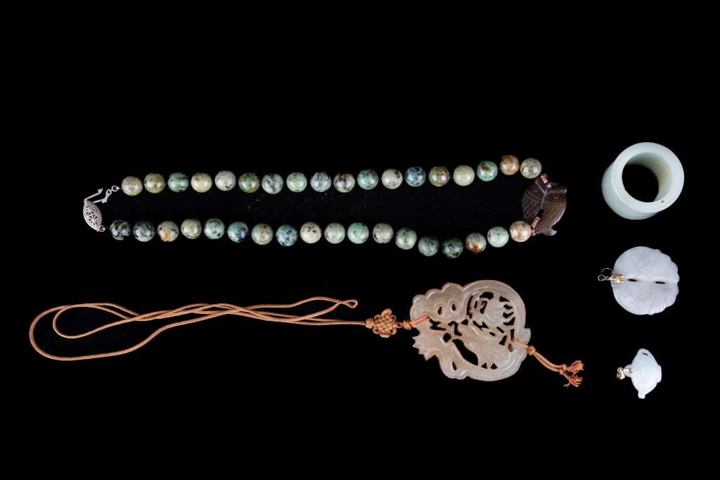 Jade & Pearl Necklaces: Stone necklace with nephrite pendant approx. 18? L. Nephrite jade cylinder approx. 1? L x 1 ?? Dia. Large nephrite jade pendant depicting scholar measuring approx. 2 ?? x 2.? Two smaller jadeite penda