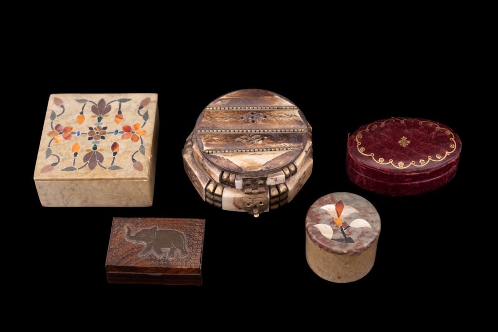 Trinket Boxes (5): Collection of trinket boxes including 2 soapstone with inlay, Indian bone box, vintage leather jewelry box and hardwood elephant box with brass mounts.