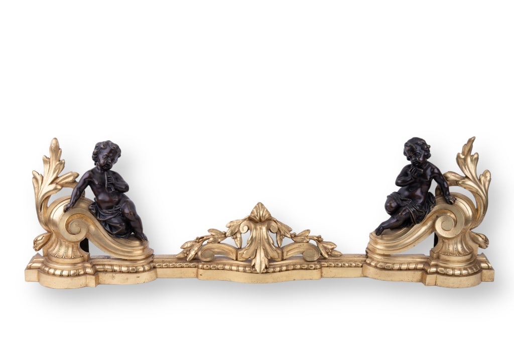 French Rococo Bronze Fireplace Accent: French 3 piece bronze fireplace accent with Rococo style ornamentation and cherubs playing musical instruments. Measures approx 11? H x 39? W. Corrosion evident on wrought iron support pieces on back.