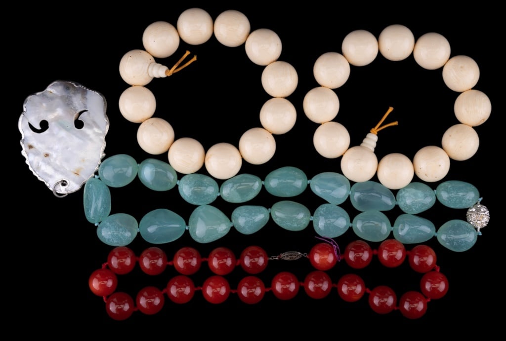 Vintage Necklaces: Carnelian orange hue sterling silver clasp necklace, carved large bracelets, large green hue fancy crystal clasp necklace and enrobed pearl shell pendant