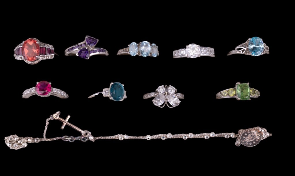 Sterling Silver Rings & Necklace: Lot of 9 sterling silver rings, some with semi precious stones, and a sterling religious necklace with Mother Mary and cross.