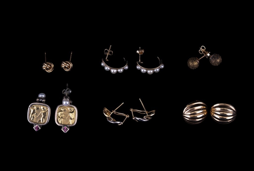 14K and 18K Gold, Sterling Semi-Precious Earrings: 5 pairs of 14K gold post earrings including a pair with 5 real pearls on each earring. Also includes a pair of dangle earrings marked 18K gold and 925 sterling with a garnet accent stone. Total 14K go