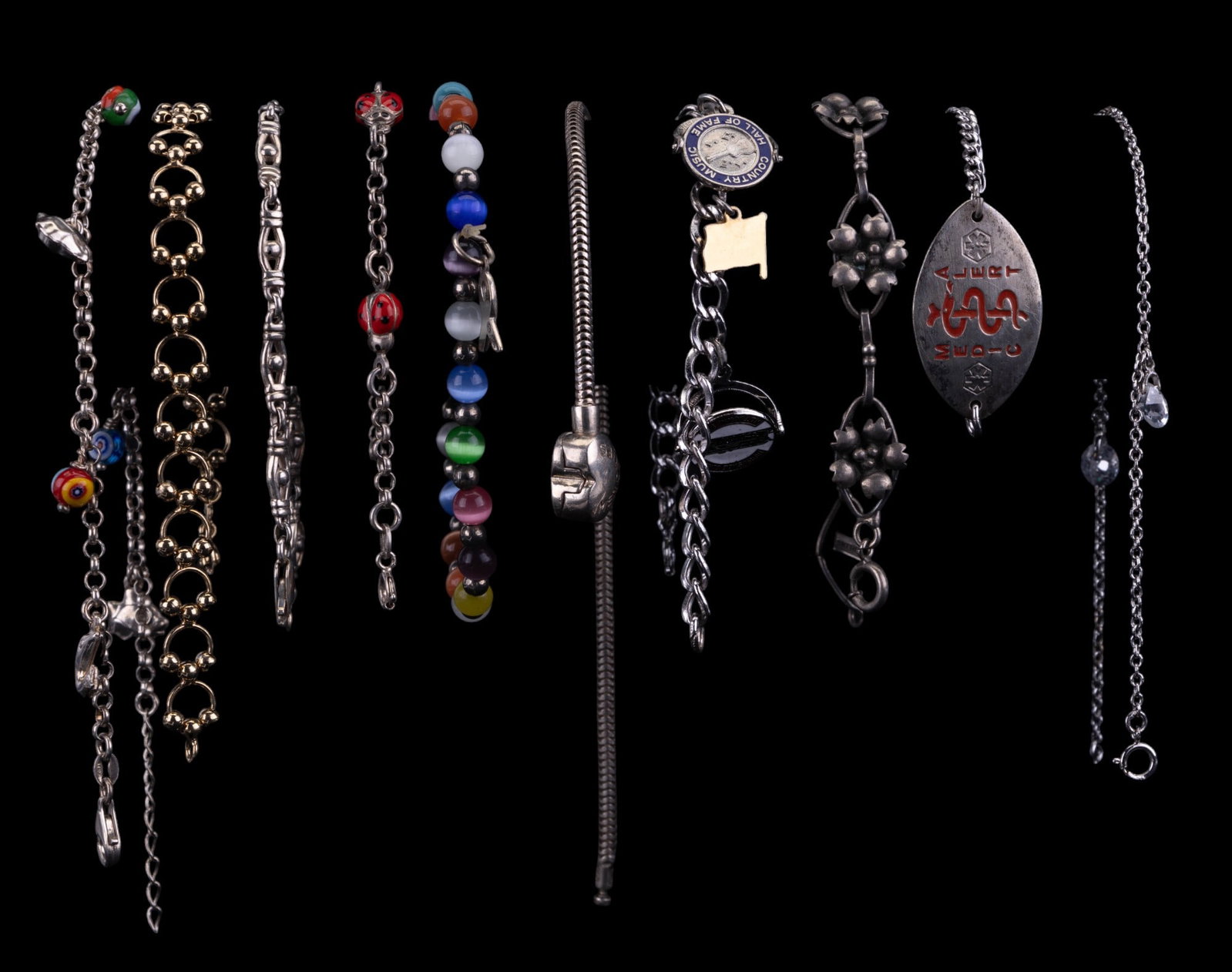 Sterling Silver Bracelets: 10 sterling silver dangle bracelets including ladybugs, charm, Memories heart, medical alert, flower and more.