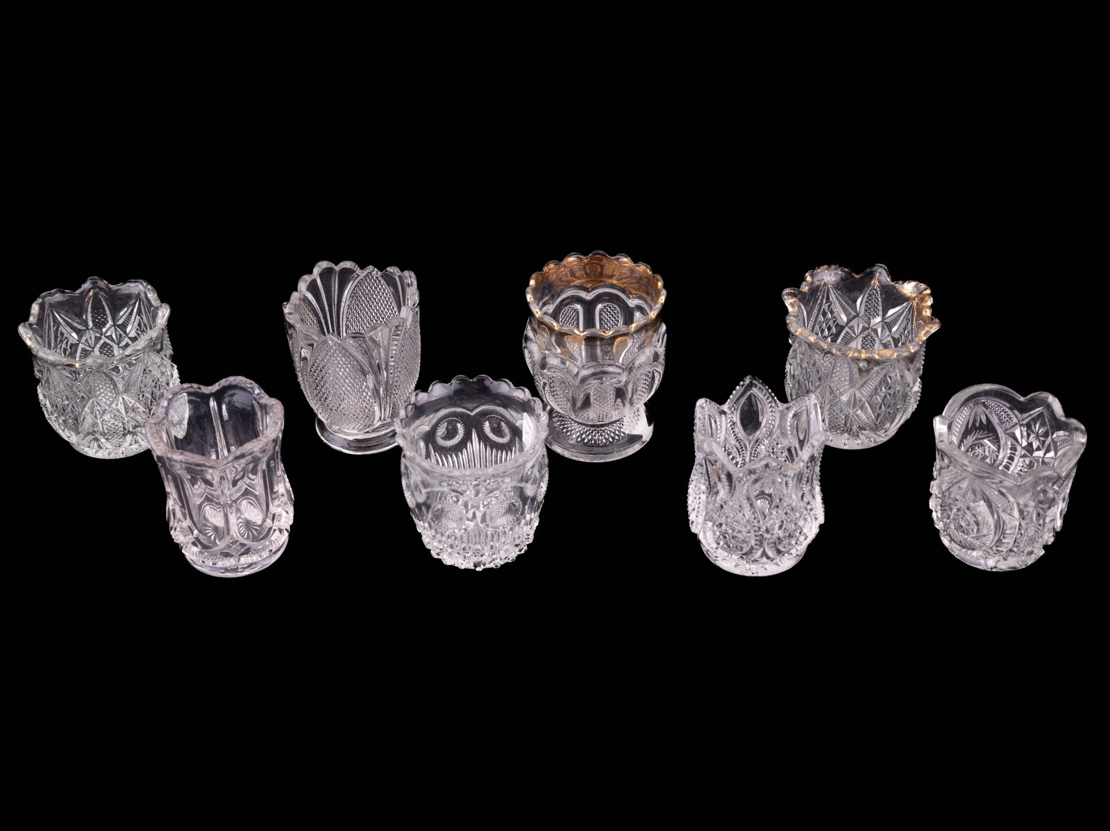 U.S. Glass Co. Toothpick Holders: 8 antique and vintage U.S. Glass Copmany toothpick holders. Designs include Manhattan (1898), New Jersey (1900), Buzzstar.Whirligig (#15101, 1907), Pennsylvania, 2 different styles, both 1898, Texas (