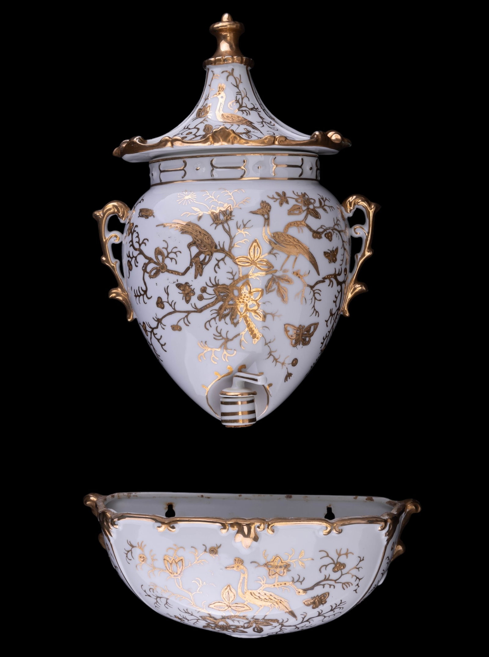 Gilded Porcelain Wall Pockets: Porcelain wall pockets with heavily gilt design. One is a samovar style pocket with lid and another is a bowl style. The samovar style measures approx 11" H with lid. There is slight gilt loss.