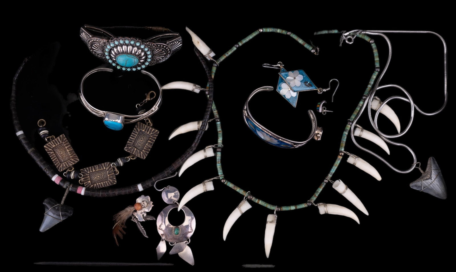 Native American Jewelry & More: Sterling silver style Native American jewelry including necklaces, cuff bracelets, earrings. There is an Alpaca cuff bracelet with matching earrings with mother of pearl flower design. There are two n