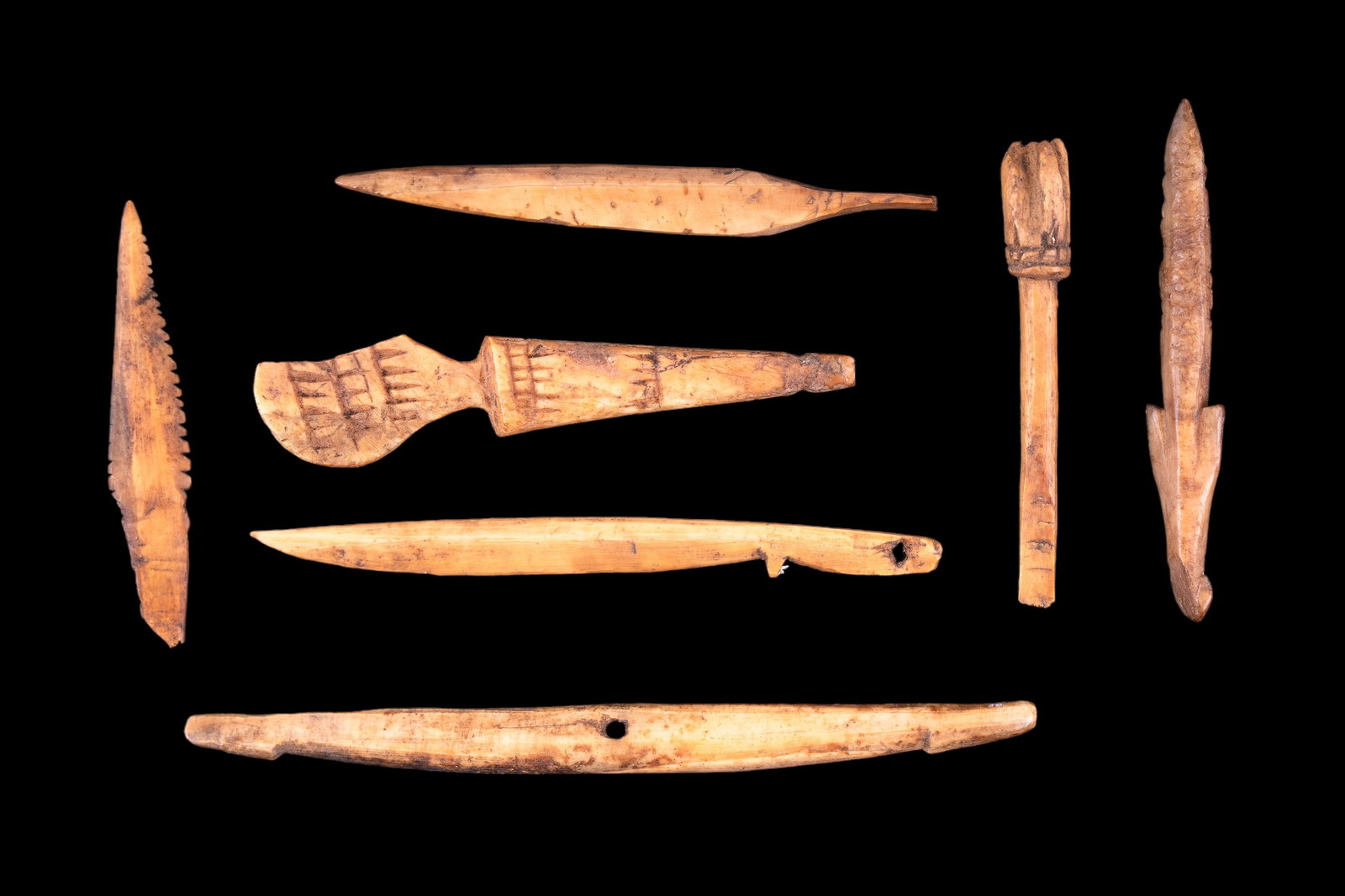 Inuit Eskimo Child Practice Made Artifacts (7): Seven fossil walrus bone diminutive size Inuit artifacts made by children for learning and practicing to make tools. From Savoonga, Alaska in the St. Lawrence Island area. Tools as listed: snow knife