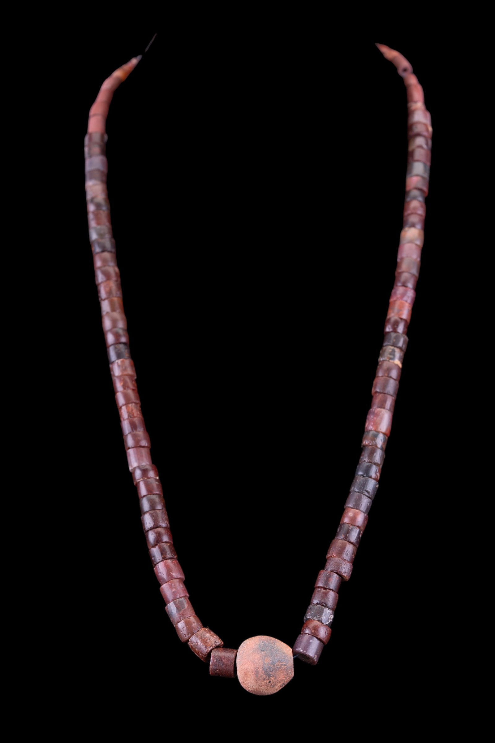 Neolithic Sahara Carnelian Beads: Graduated string of Neolithic carnelian and jasper barrel bead necklace with terracotta ball beads. Approx 28" L and approx 300+ years old.