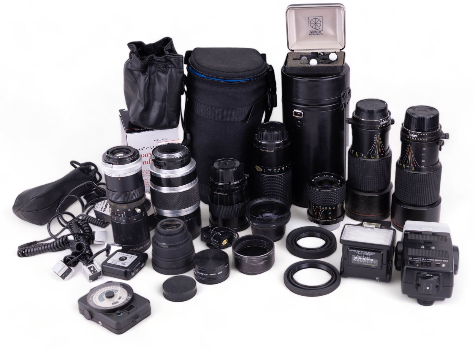 Tokina 80-200 Lenses & More: Collection of assorted lenses and camera accessories including: ?Tokina AT-X 80-200mm F2.8 Nikon mount lens with skylight filter, caps, and hard case ?Tokina AT-X 80-200mm F2.8 Nikon mount lens with c