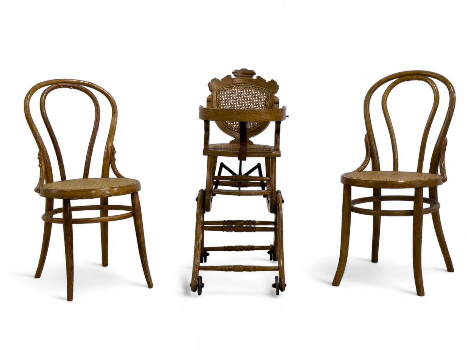 Oak Highchair and Two Side Chairs: The Victorian highchair measures 36? H with a cane back and bottom. Oak bentwood side chairs have a cane seat as well.